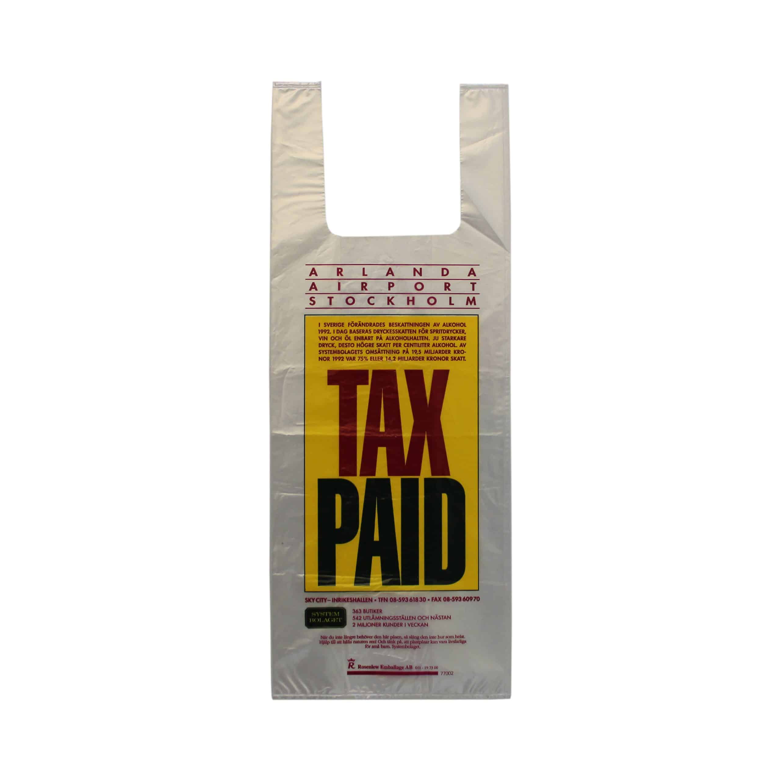 Genomskinlig plastpåse med olikfärgat tryckTax paid - taxfree-påse med information om ändrad alkoholbeskattning.Tidpunkt: 1993; Deponent: Systembolaget / Systembolaget AB; Motiv-ID: SYS010111